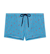Blue swim shorts with red pepper pattern and drawstring on a white background
